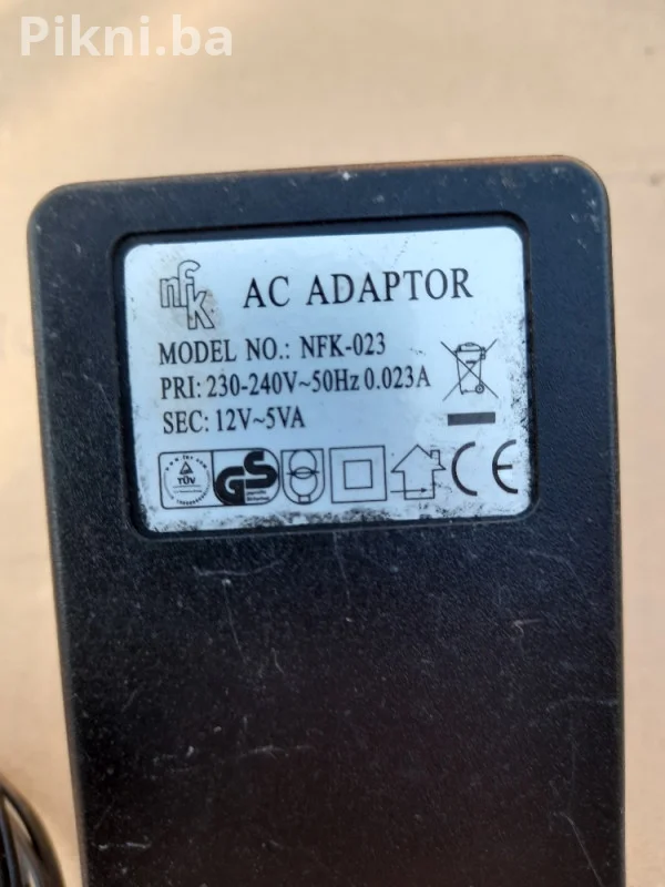 AC/AC ADAPTER 12V ~ 5VA (model NFK-023) prtevarač ispravljač punjač